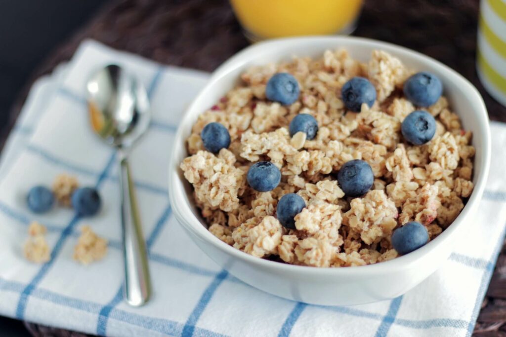 granola in a bowl with blueberries